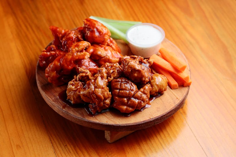 Buffalo wings with blue cheese dipping sauce