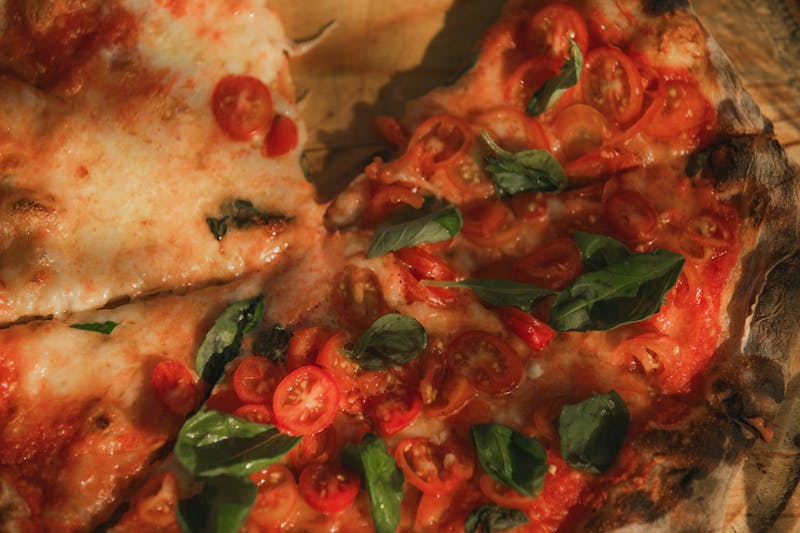 Freshly baked Pequod's deep-dish pizza on a wooden table